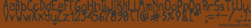 QueenDestroyTfb Font – Black Fonts on Brown Background