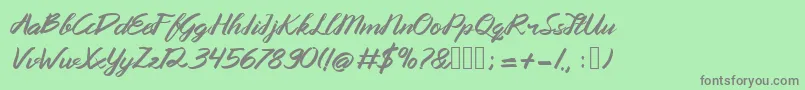 フォントQueenata – 緑の背景に灰色の文字