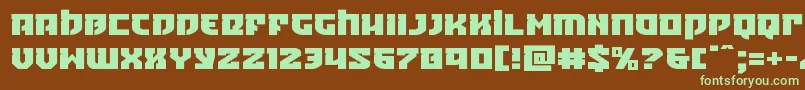フォントCrazyivanexpand – 緑色の文字が茶色の背景にあります。