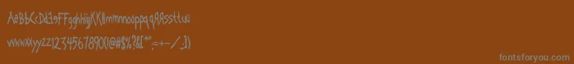 Czcionka Kornucopia – szare czcionki na brązowym tle