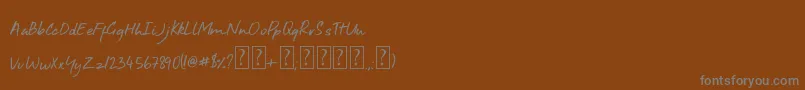 Aroha-fontti – harmaat kirjasimet ruskealla taustalla