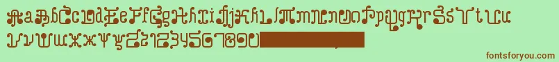 フォントTurkAndNusa – 緑の背景に茶色のフォント