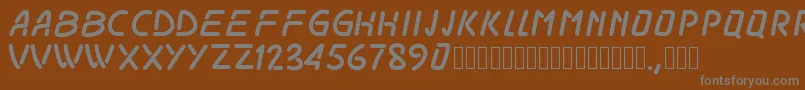 Pwodissey-fontti – harmaat kirjasimet ruskealla taustalla