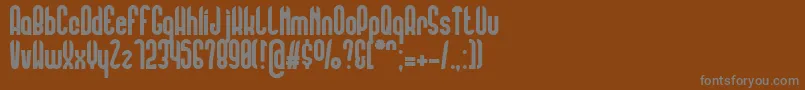 FlorentineAmber-fontti – harmaat kirjasimet ruskealla taustalla