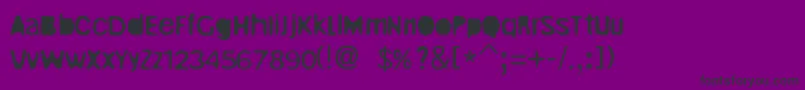 Czcionka UnrulyRegular – czarne czcionki na fioletowym tle