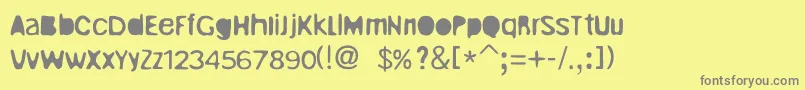 UnrulyRegular-Schriftart – Graue Schriften auf gelbem Hintergrund