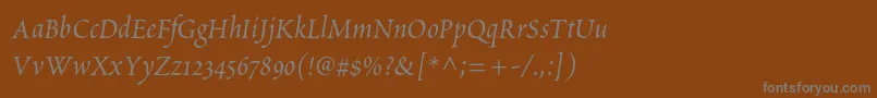 フォントPoeticastd – 茶色の背景に灰色の文字