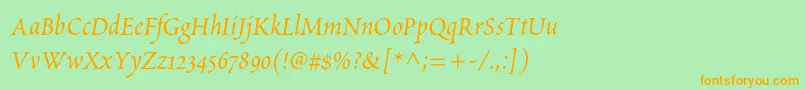 フォントPoeticastd – オレンジの文字が緑の背景にあります。