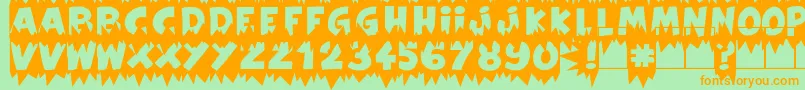 フォントExtraSalesBlank – オレンジの文字が緑の背景にあります。