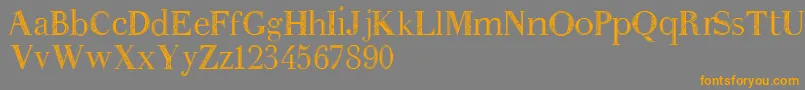 フォントAnakatrinatan – オレンジの文字は灰色の背景にあります。