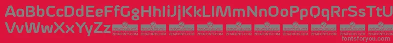 Czcionka ByomBoldTrial – szare czcionki na czerwonym tle