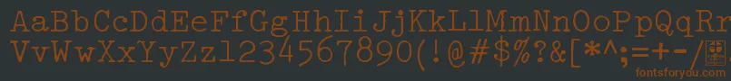 Шрифт TypowriterDistressedDemo – коричневые шрифты на чёрном фоне