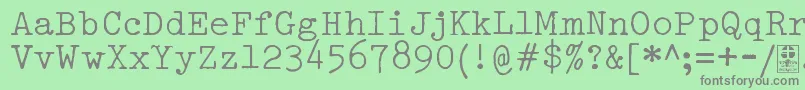 Шрифт TypowriterDistressedDemo – серые шрифты на зелёном фоне