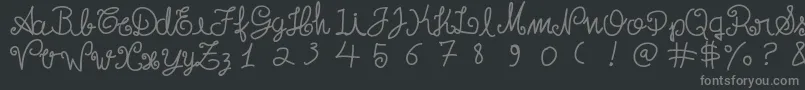 フォントEscritatoska – 黒い背景に灰色の文字