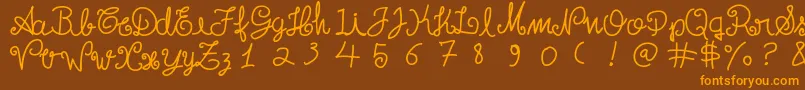 Escritatoska Font – Orange Fonts on Brown Background