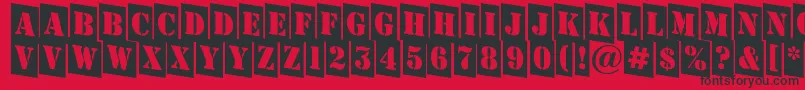 フォントAStampercmdn – 赤い背景に黒い文字