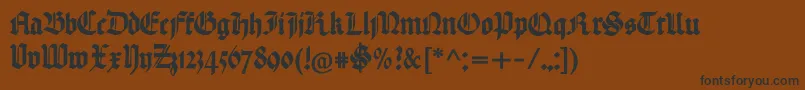 フォントHandtextur – 黒い文字が茶色の背景にあります