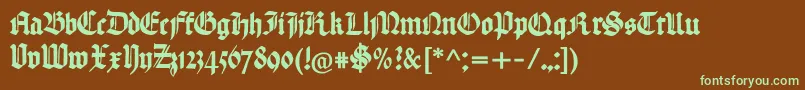 フォントHandtextur – 緑色の文字が茶色の背景にあります。