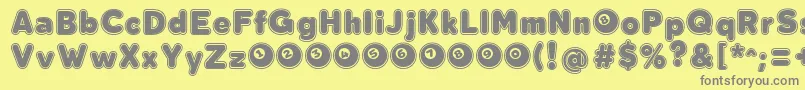 フォントBolaOchoCollegeFontFfp – 黄色の背景に灰色の文字