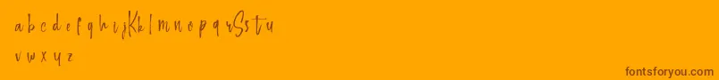 Keepscrollingdemo-Schriftart – Braune Schriften auf orangefarbenem Hintergrund