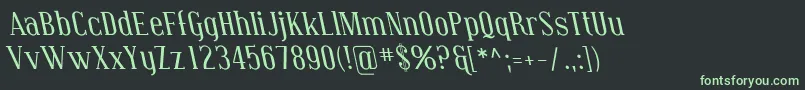 フォントCovingtonRevItalic – 黒い背景に緑の文字