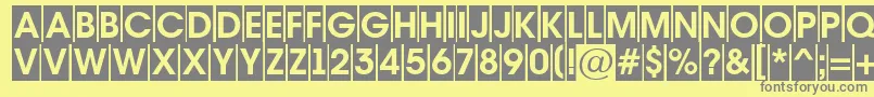 AAvantetitulcmBold-fontti – harmaat kirjasimet keltaisella taustalla