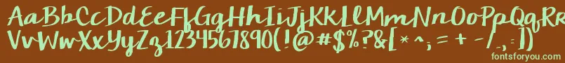 フォントKgchelseamarketscript – 緑色の文字が茶色の背景にあります。