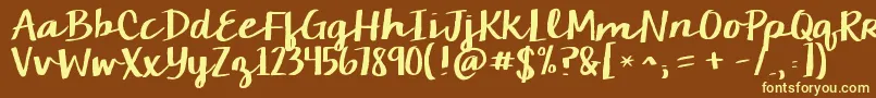 Kgchelseamarketscript-fontti – keltaiset fontit ruskealla taustalla