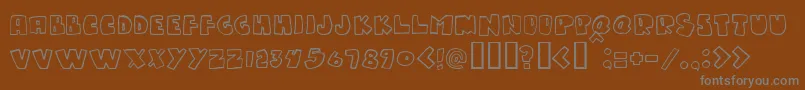 Gumpy-fontti – harmaat kirjasimet ruskealla taustalla