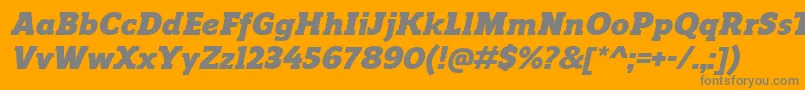 ReganslabBlackitalic-fontti – harmaat kirjasimet oranssilla taustalla