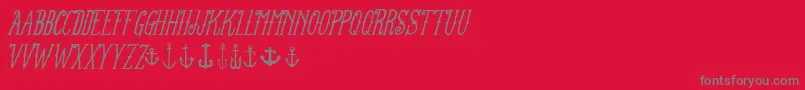 FtanchoryardItalic-Schriftart – Graue Schriften auf rotem Hintergrund