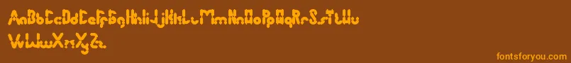 フォントAntiqueRetro – オレンジ色の文字が茶色の背景にあります。