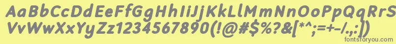 RobagaRoundedBlackItalic-fontti – harmaat kirjasimet keltaisella taustalla
