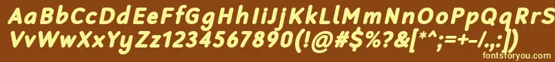 RobagaRoundedBlackItalic-fontti – keltaiset fontit ruskealla taustalla