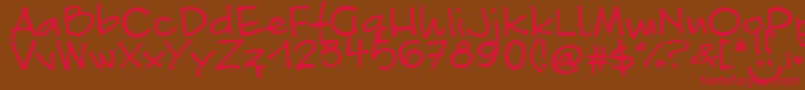 フォントFontLinda.Sciutto – 赤い文字が茶色の背景にあります。