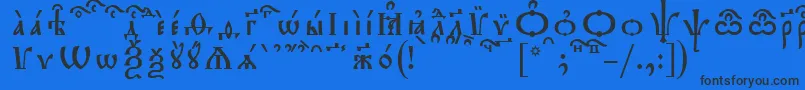 Czcionka TriodionKucsSpacedout – czarne czcionki na niebieskim tle
