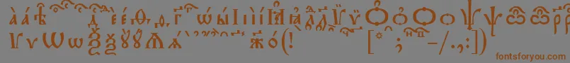 フォントTriodionKucsSpacedout – 茶色の文字が灰色の背景にあります。
