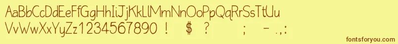 QlinickleFree Font – Brown Fonts on Yellow Background