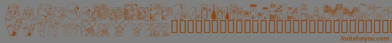 フォントCrazyzoo – 茶色の文字が灰色の背景にあります。