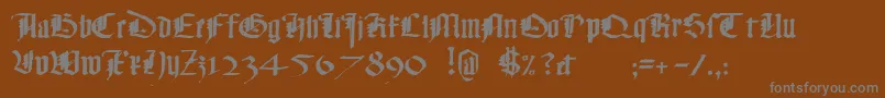 Monky-Schriftart – Graue Schriften auf braunem Hintergrund