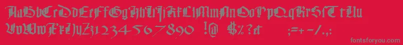 Fonte Monky – fontes cinzas em um fundo vermelho