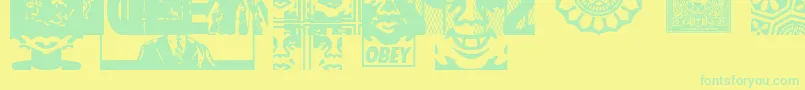 ObeyassortyCaps-Schriftart – Grüne Schriften auf gelbem Hintergrund