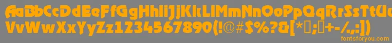 フォントTenacessk – オレンジの文字は灰色の背景にあります。