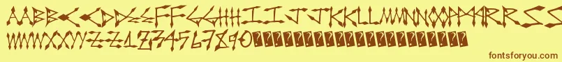 フォントDiamondcut – 茶色の文字が黄色の背景にあります。