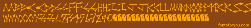 フォントDiamondcut – オレンジ色の文字が茶色の背景にあります。