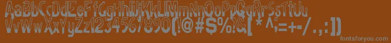 BadhRegularTtstd-Schriftart – Graue Schriften auf braunem Hintergrund