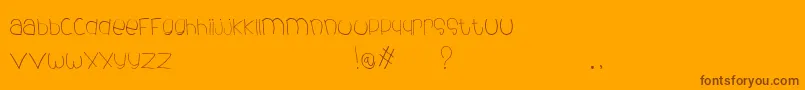 Czcionka DeChildFont – brązowe czcionki na pomarańczowym tle