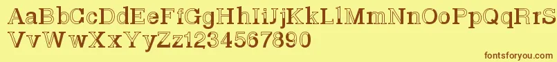 フォントBasveticafontlab – 茶色の文字が黄色の背景にあります。