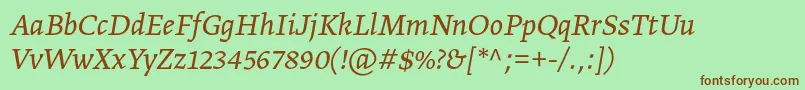 フォントGretatextproLightitalic – 緑の背景に茶色のフォント
