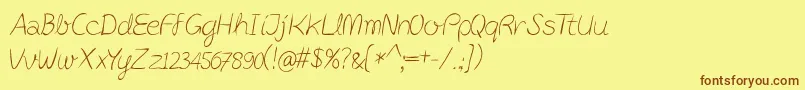 フォントPostitPenscript – 茶色の文字が黄色の背景にあります。